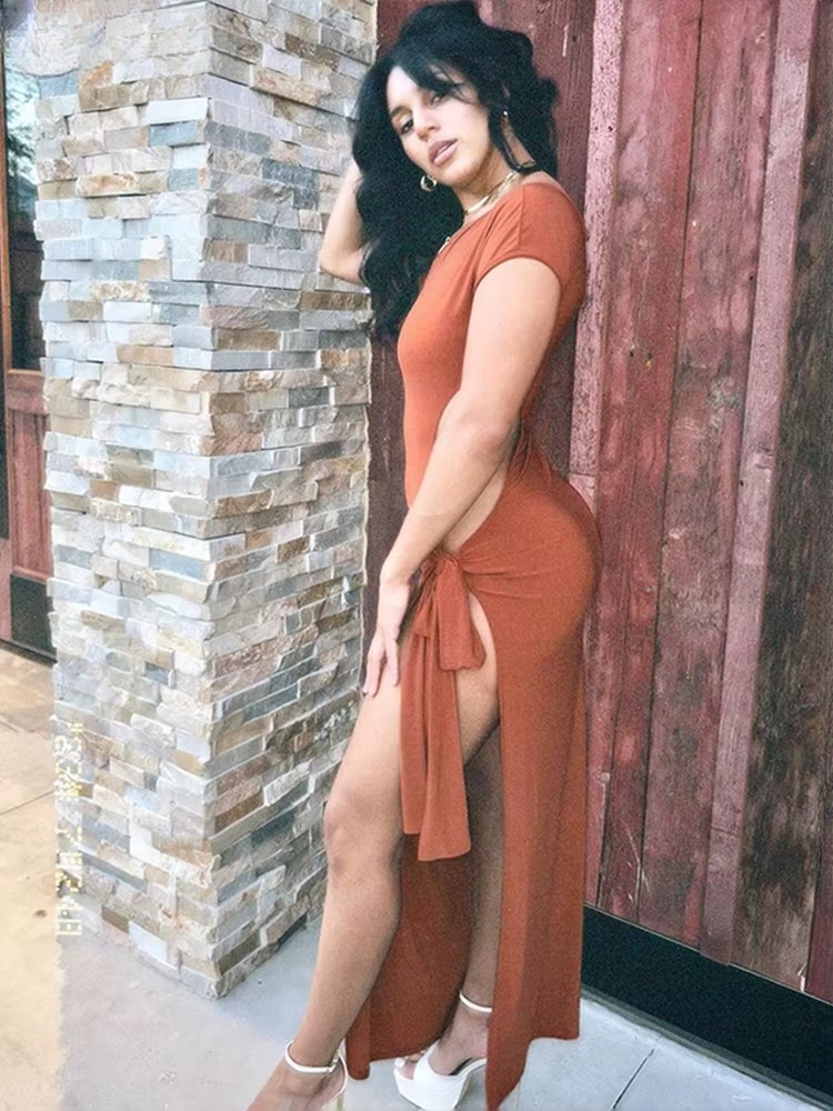 Elegant Irregular Hollow Diagonal Collar Sleeveless Bandage Tassel Long Bodycon Dress